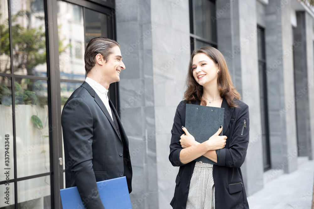 Two caucasian businessman happy and smile standing at front office building in city.. Two caucasian businessman happy and smile standing at front office building in city..