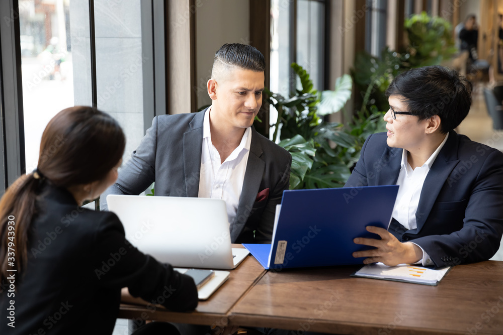 Group Business people meeting and working Using Laptop in cafe. Share idea, Technology, Communication, Brainstorming and Teamwork concept. Group Business people meeting and working Using Laptop in cafe. Share idea, Technology, Communication, Brainstorming and Teamwork concept.
