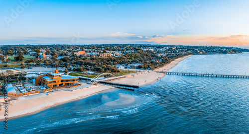 Aerial panorama of Frankston Yacht Club, footbridge and the pier at sunset in Melbourne, Australia photo