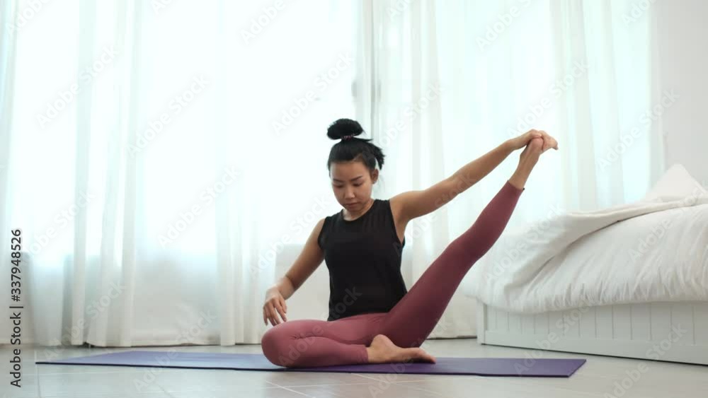 4k Young woman practice yoga in a bedroom in a morning 4k Young woman practice yoga in a bedroom in a morning