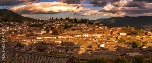 Panorama Top view scene of ancient LiJiang old town, is the historical center of Lijiang City, in Yunnan, China. It is a UNESCO World, culture and traditional, travel and tourist, holiday concept