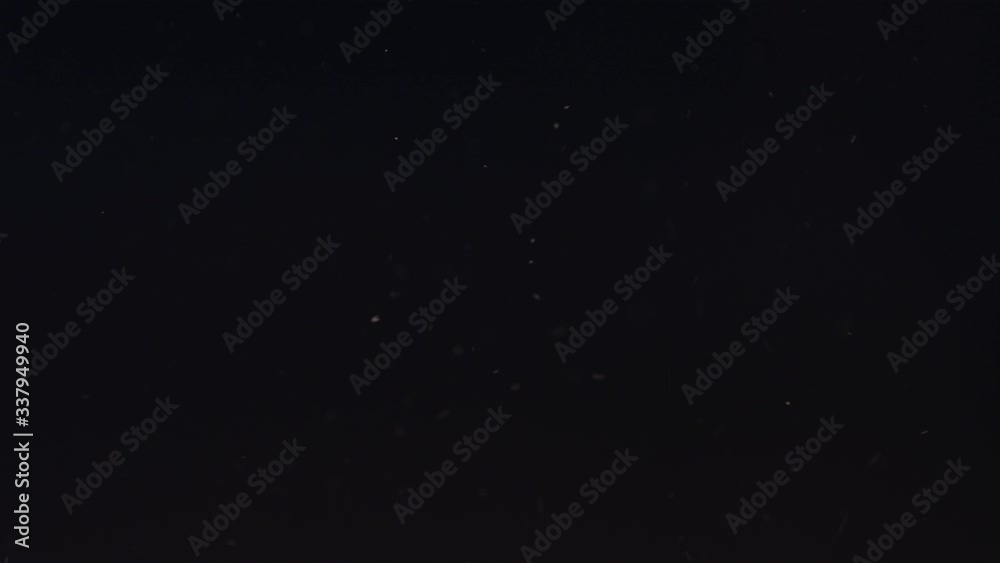 Particle dust cloud dynamically floating with turbulent wind on black background 4k Particle dust cloud dynamically floating with turbulent wind on black background 4k