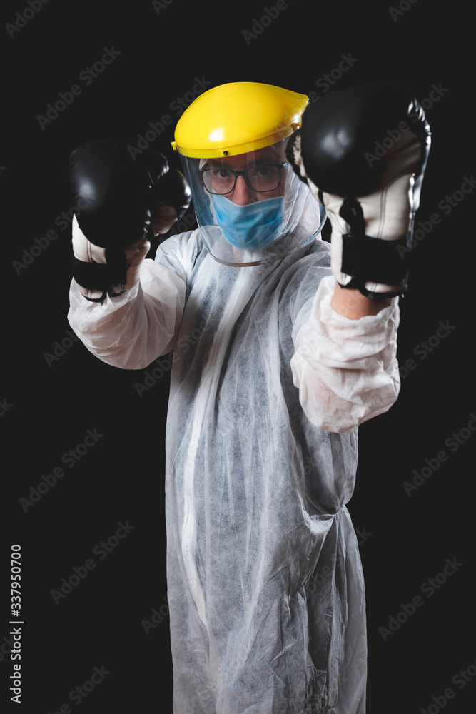 Doctor / surgeon / scientist with boxing gloves ready to fight the virus and illness.