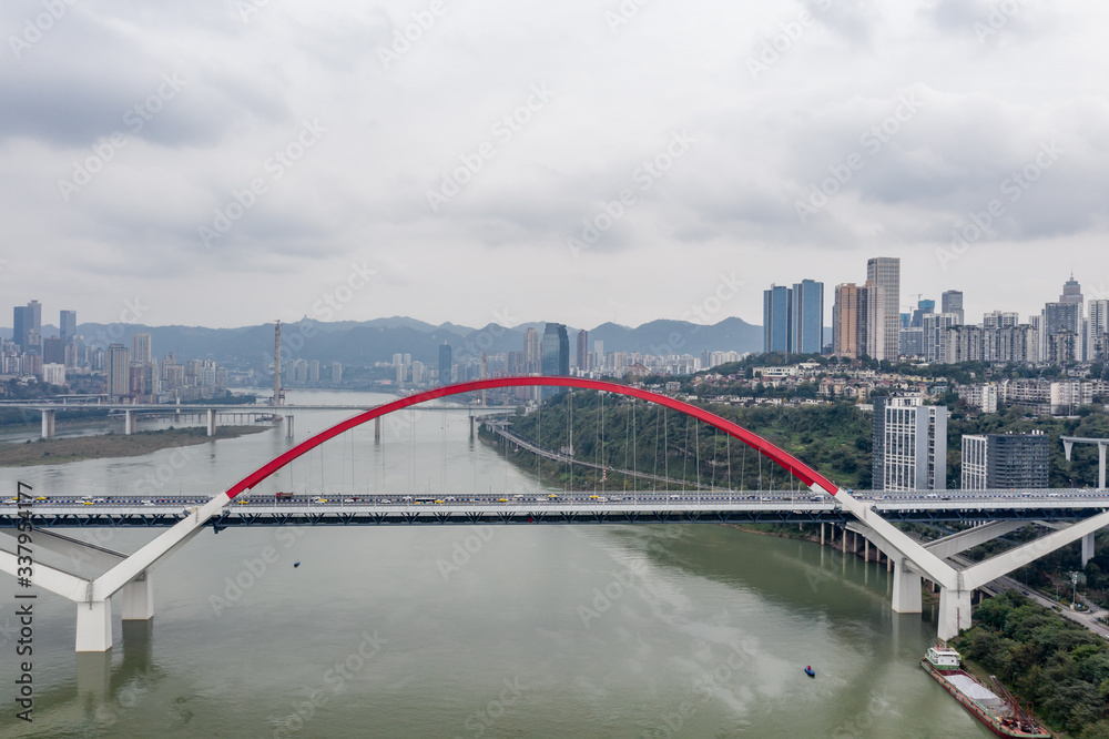 Obraz premium Aerial drone shot of Caiyuanba bridge over Jialing river in Chongqing, southwest China