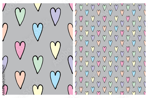 Cute Hand Drawn Colorful Irregular Hearts Vector Patterns. Pink, Blue, Yellow, Grenn and Blue Hearts with Black Outline Isolated on a Light Gray Background. Funny Infantile Style Romantic Design.