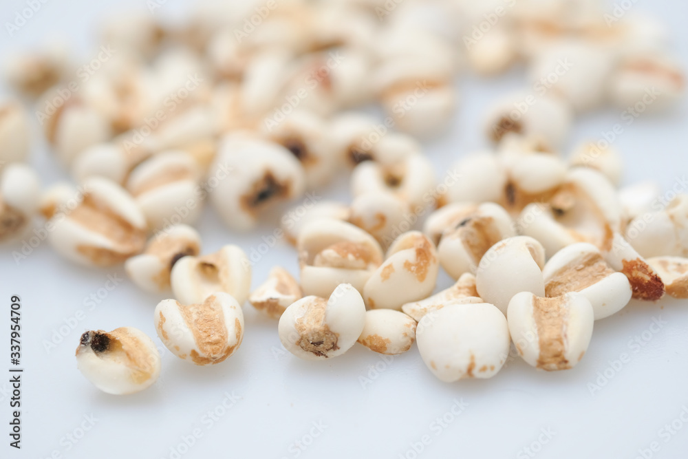 millet in a wooden bowl isolated on white millet in a wooden bowl isolated on white