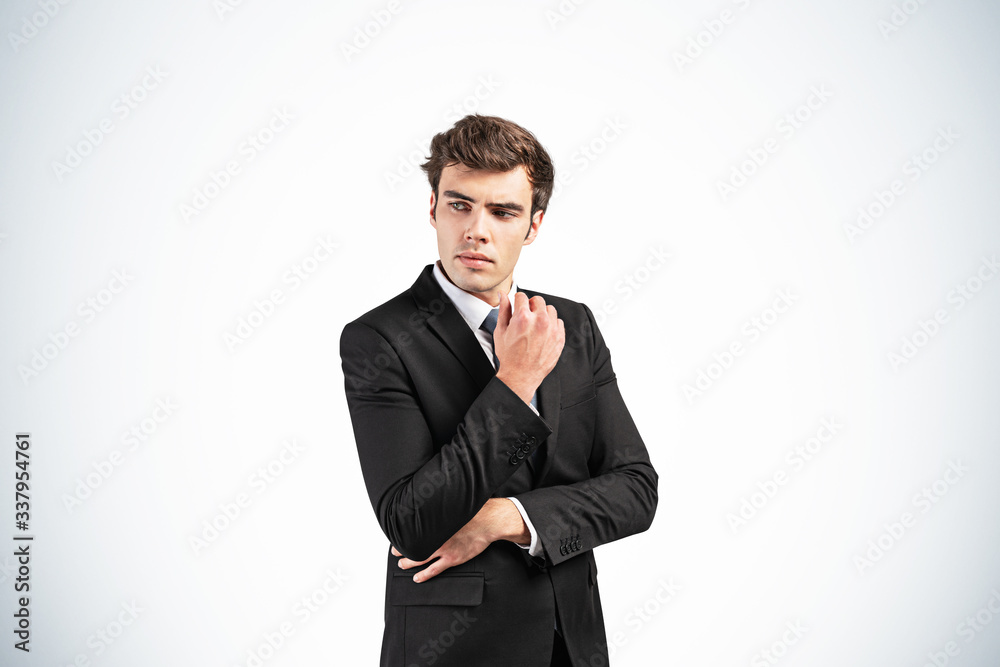 Thoughtful young European businessman portrait