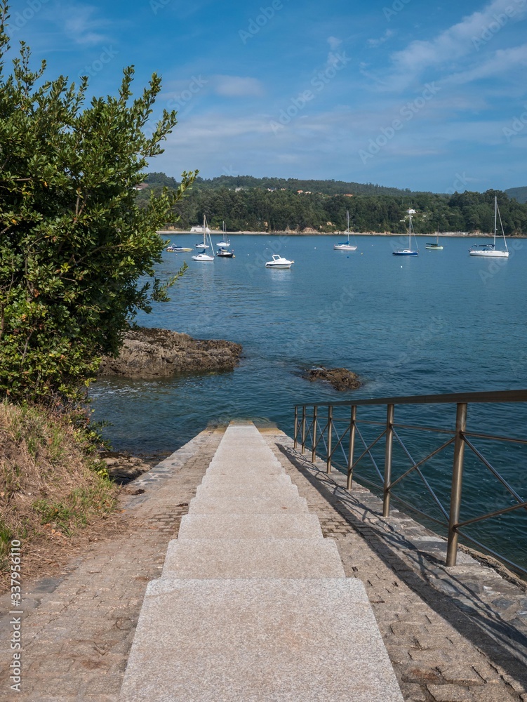 Stairway leading down to the shore in the area of the harbor of Redes, Ares, Galicia, Spain