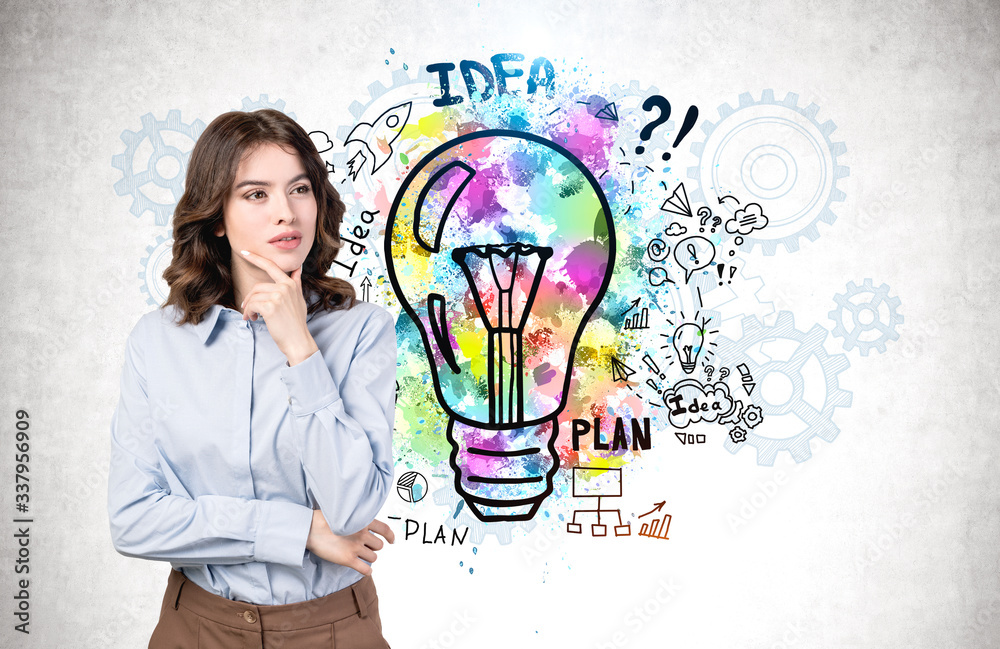 Thoughtful young woman and her business idea Thoughtful young woman and her business idea