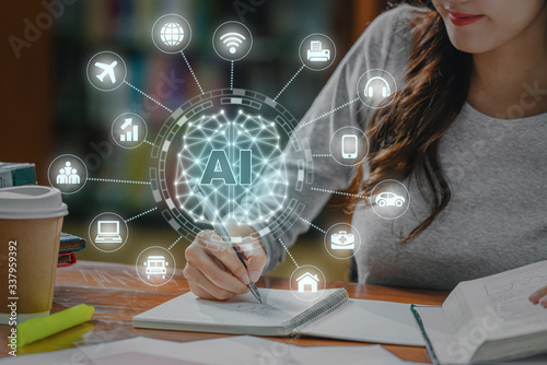 Obraz na płótnie Polygonal brain shape of an artificial intelligence with various icon of smart city Internet of Things Technology over Asian young Student hand writing homework in library of university or colleage w salonie