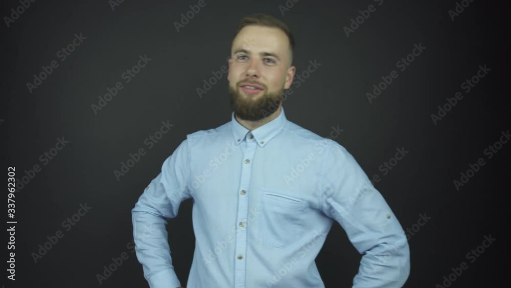 man with beard poses for photo shoot holding hands on hips man with beard poses for photo shoot holding hands on hips