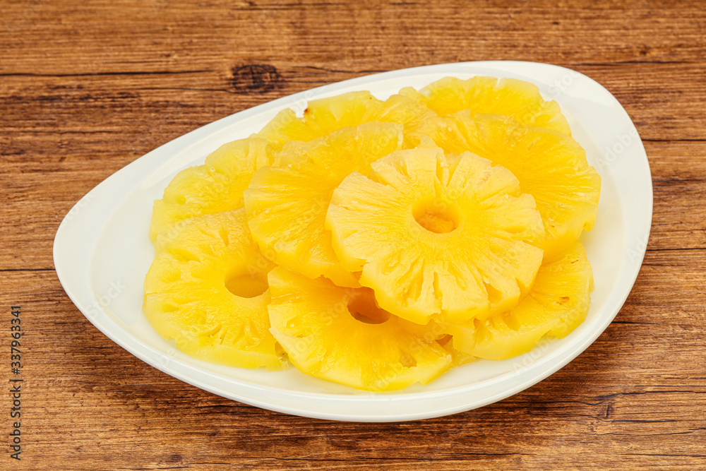 Marinated pineapple rings in the bowl Marinated pineapple rings in the bowl