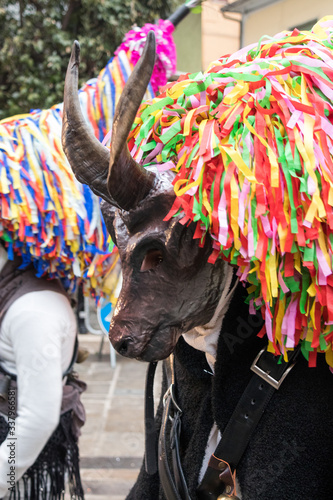 horned masks of Aliano in the ancient carnival of Lucania.colorful masks of strange shapes and large horns. Aliano, Matera, Basilicata, Italy photo