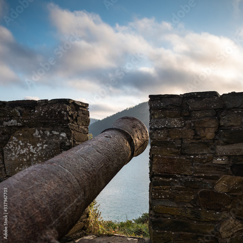Detail of a cannon and merlons of the fortress Castillo de la Concepción in Cedeira, Rías Altas, La Coruña, Spain