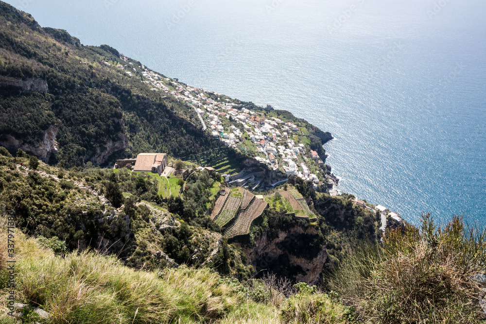 Beautiful view on Praiano with terraced lemon fields seen from the Path of the Gods (Sentiero degli Dei), Trekking route from Agerola to Nocelle. Amalfi coast, Campagnia region, Italy Beautiful view on Praiano with terraced lemon fields seen from the Path of the Gods (Sentiero degli Dei), Trekking route from Agerola to Nocelle. Amalfi coast, Campagnia region, Italy