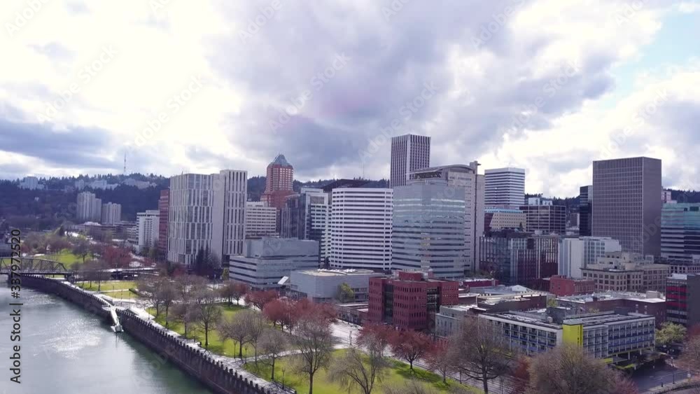 Aerial flying towards downtown Portland Oregon city skyline during the corona virus outbreak and after the 