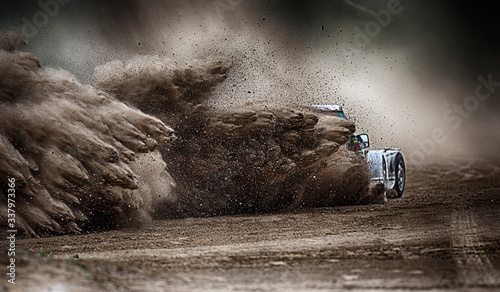 Racing sports car in dust clubs on the track , rally © Sky Antares
