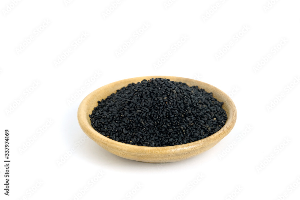 Top view sweet basil seeds on wooden bowl – isolated on white background Top view sweet basil seeds on wooden bowl – isolated on white background