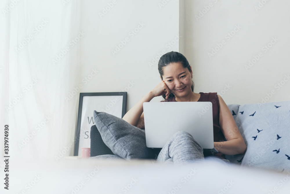 work from home.using computer.hand typing keyboard laptop online chatting search form internet while working sitting on sofa.concept for technology device contact communication business people work from home.using computer.hand typing keyboard laptop online chatting search form internet while working sitting on sofa.concept for technology device contact communication business people