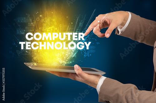Close-up of a touchscreen with COMPUTER TECHNOLOGY inscription, innovative technology concept
