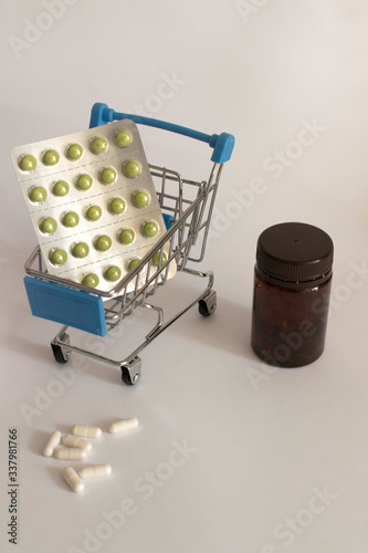 pills in a basket on a white background
