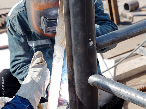 Welding work ,worker with protective welding metal on construction