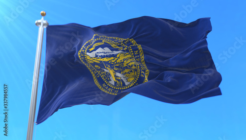 Flag of american state of Nebraska, region of the United States, waving at wind photo