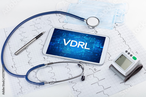 Close-up view of a tablet pc with VDRL abbreviation, medical concept photo