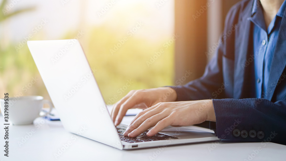 Businessman or accountant working on laptop computer with business document, business financial accounting concept. Businessman or accountant working on laptop computer with business document, business financial accounting concept.