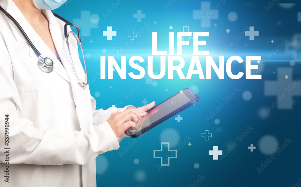 doctor writes notes on the clipboard with LIFE INSURANCE inscription, first aid concept doctor writes notes on the clipboard with LIFE INSURANCE inscription, first aid concept