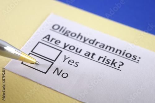 One person is answering question about oligohydramnios. photo