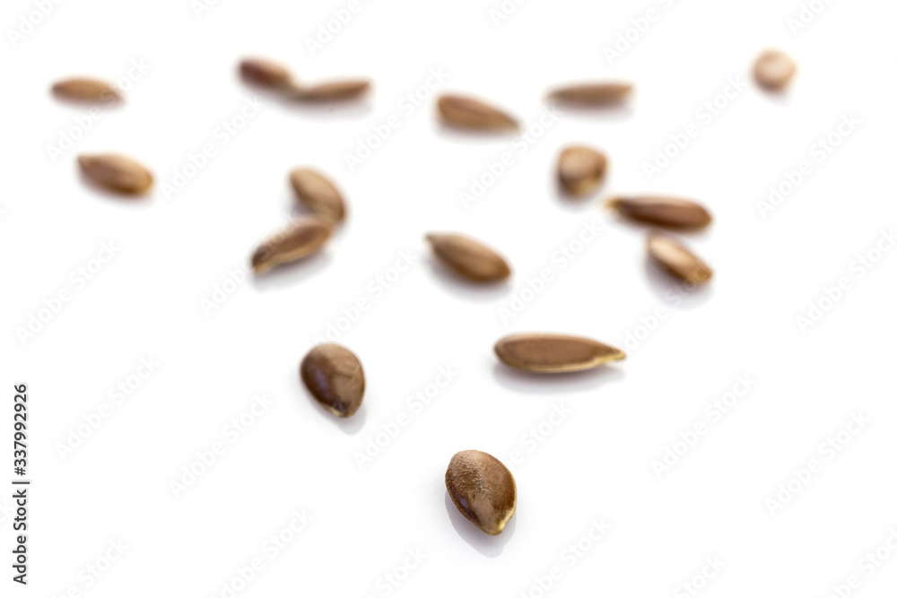 Brown Flax seed background. Pile food Linseed or flaxseed isolated on white. Healthy eating, dieting and detoxication concept, space for text. Macro close-up shot. Brown Flax seed background. Pile food Linseed or flaxseed isolated on white. Healthy eating, dieting and detoxication concept, space for text. Macro close-up shot.