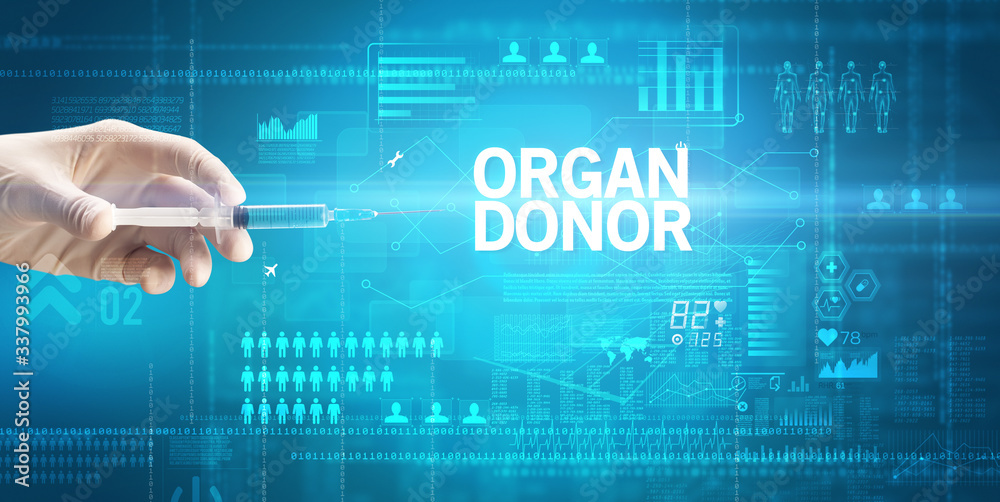 Close-up view of doctor's hand in a white glove holding syringe with ORGAN DONOR inscription, healthcare and medical concept Close-up view of doctor's hand in a white glove holding syringe with ORGAN DONOR inscription, healthcare and medical concept