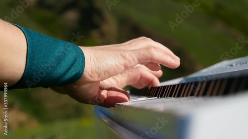 woman plays synthesizer outdoor photo