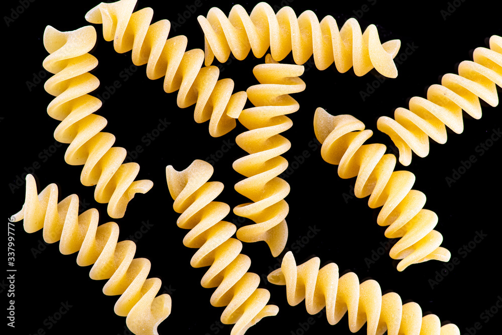 Fototapeta premium fusili pasta isolated on a black or white background
