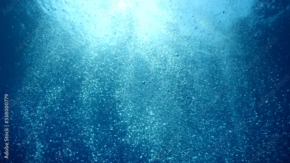 air bubbles underwater  bubbles coming up to the surface blue water ocean scenery