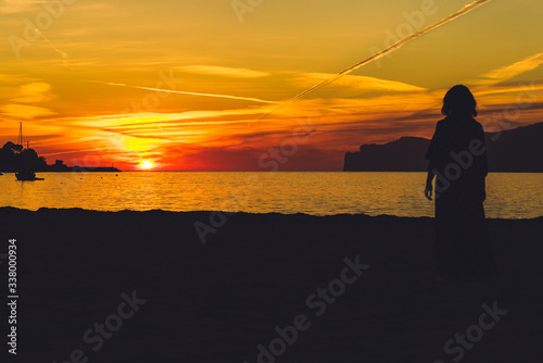 Womans Silhouette on Sunset