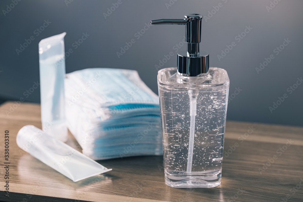 Hand sanitizer alcohol gel Antivirus protection and medical surgical masks with standard to prevent coronavirus COVID-19 infection.Medical protective on wood background.Healthcare and medical concept. Hand sanitizer alcohol gel Antivirus protection and medical surgical masks with standard to prevent coronavirus COVID-19 infection.Medical protective on wood background.Healthcare and medical concept.