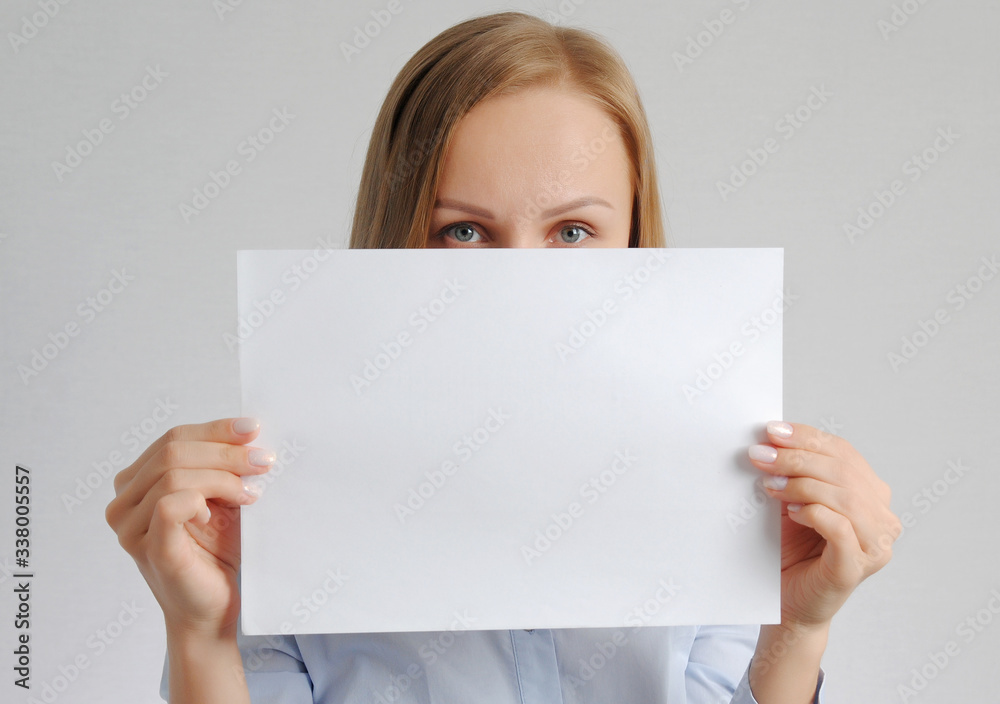pretty girl with empty paper sheet. Poster with copy-space concept pretty girl with empty paper sheet. Poster with copy-space concept