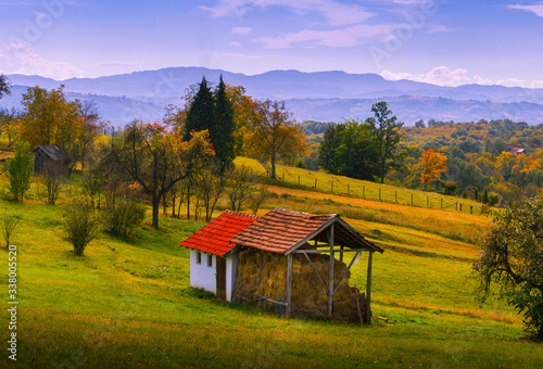 Old stable and barn. Farm in spring. Mountain region of Serbia, Europe. Agriculture business.
