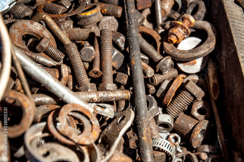 rusty bolts and nuts in a box