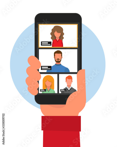 Close-up of a hand with a cell phone from behind communicating by video conference. Virtual meeting. Video conference. Video chat. Video call.