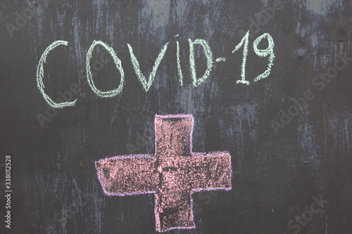 Inscription COVID-19 on blue background. World Health Organization WHO introduced new official name for Coronavirus disease named COVID-19 2020 year
