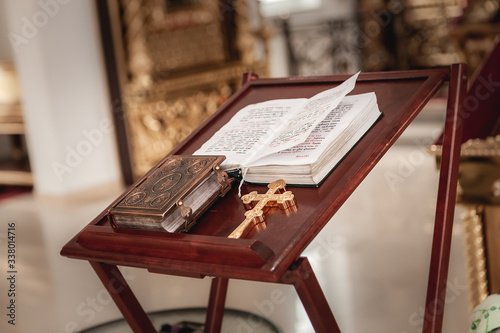 the book and the cross are on the table