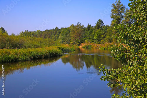 A winding shallow river on a clear summer day.
