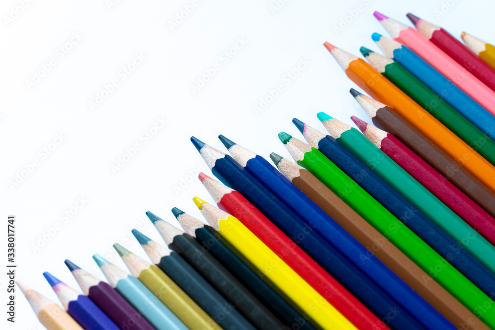 Top view colored pencils on a white background.