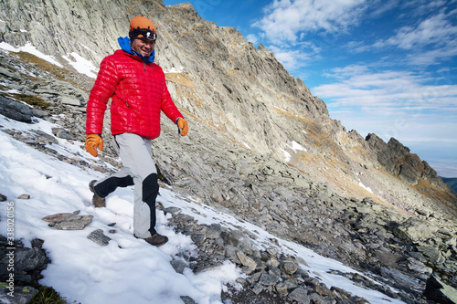 Young alpinist trekking in the Transylvanian Alps, Romania, Europe