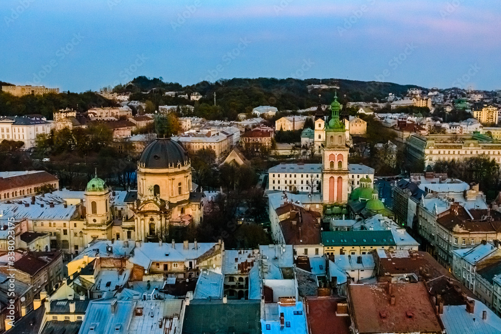 View on Dominican cathedral, Dormition church and historic center of the Lviv at sunset. View on Lvov cityscape from the town hall
