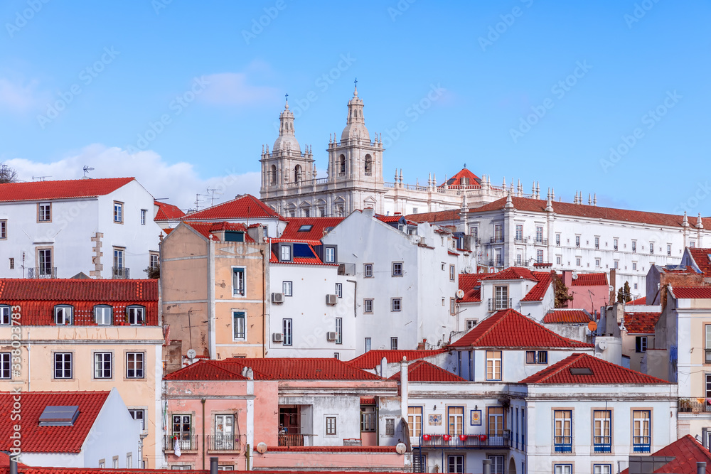 A classic hilltop view of houses in Lisbon. On the top Monastery of St. Vincent Outside the Walls (Igreja de São Vicente de Fora) Lisbon, Portugal