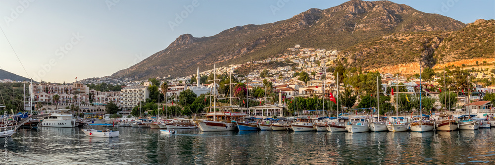 View across the tourist boats to Kalkan Old Town and the hills above